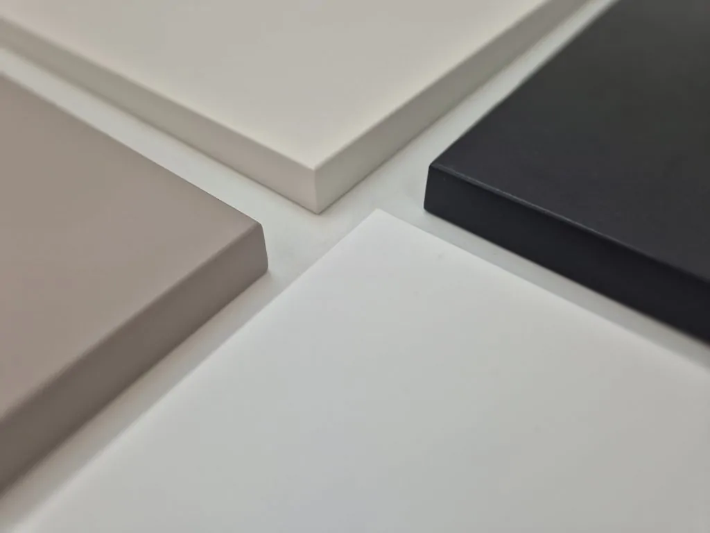 Powder-coated MDF finish samples in a range of neutral colours